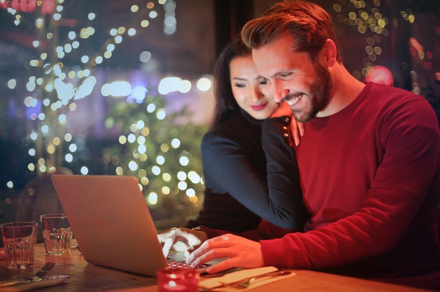 A happy couple shopping online